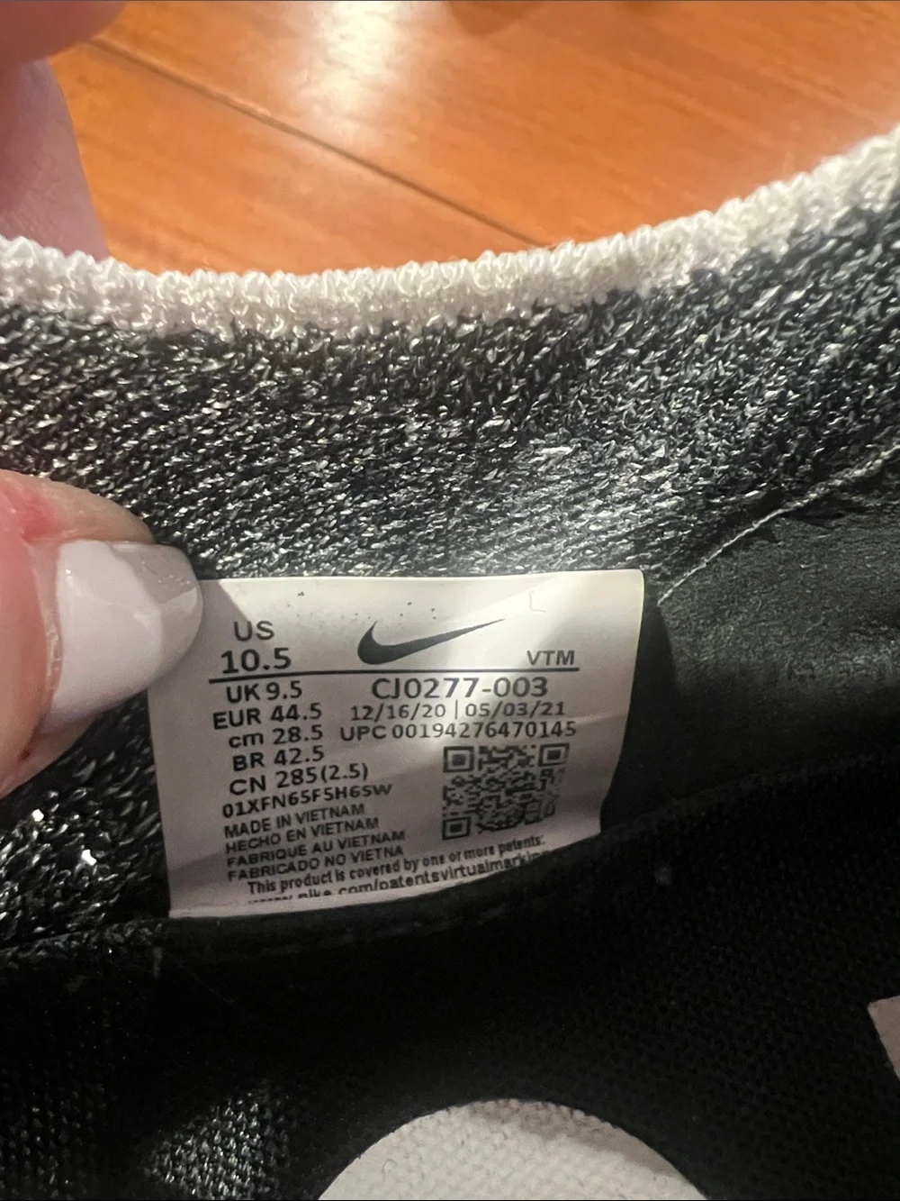 Nike Men’s Black and White Knit Slip-On Sneakers